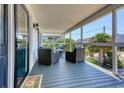 Relaxing screened-in porch with comfortable seating, perfect for enjoying the outdoors at 312 35Th Ave. N, North Myrtle Beach, SC 29582