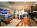 Spacious living area with hardwood floors, modern decor, and open floor plan to kitchen at 318 Castle Dr. # 1443, Myrtle Beach, SC 29579