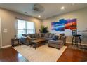Bright living room with comfortable seating and hardwood floors at 318 Castle Dr. # 1443, Myrtle Beach, SC 29579