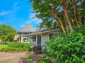 View of exterior with an American flag, foliage, and a gazebo at 323 Wendover Ct. # 10-A, Myrtle Beach, SC 29572