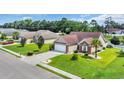 An attractive single-Gathering home with a spacious yard, mature landscaping, and a two-car attached garage at 405 Vintage Circle, Myrtle Beach, SC 29579