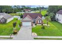 An attractive single-Gathering home with a spacious yard, mature landscaping, and a two-car attached garage at 405 Vintage Circle, Myrtle Beach, SC 29579