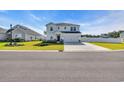 Beautiful two-story home showcasing a well-kept lawn, a double car garage and classic curb appeal on a sunny day at 4115 Bayhill St., Myrtle Beach, SC 29579