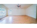 Spacious living room featuring hardwood flooring and bright windows at 434 Deer Path, Calabash, NC 28467