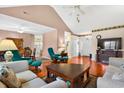 Spacious living room with hardwood floors, comfortable seating, and natural light at 435 Seneca St. Nw, Calabash, NC 28467