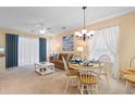 Open-concept living and dining area with a ceiling fan and lots of natural light at 556 White River Dr. # 44F, Myrtle Beach, SC 29579