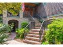 Inviting front entrance featuring a brick staircase, detailed railing and decorative entryway at 58 Swan Point Trail, Georgetown, SC 29440