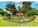 Well maintained entrance to Tanglewood community surrounded by flowerbeds and lush green foliage at 6095 Catalina Dr. # 714, North Myrtle Beach, SC 29582