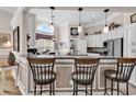 Stylish kitchen showcasing granite counters, a breakfast bar, pendant lighting and views to nook at 6434 Longwood Dr., Murrells Inlet, SC 29576