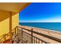 Scenic ocean view balcony featuring comfortable seating, and attractive yellow stucco at 6900 N Ocean Blvd. # 840, Myrtle Beach, SC 29572