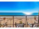 Relaxing ocean view balcony with comfortable seating, and a stylish railing at 6900 N Ocean Blvd. # 840, Myrtle Beach, SC 29572