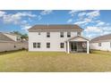 Expansive backyard featuring a covered porch, perfect for outdoor entertaining and relaxation at 701 Rupert Dr, Conway, SC 29526