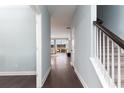 Inviting entryway featuring wood floors, neutral paint, and a staircase leading to the upper level at 721 Doonbeg Ct., Conway, SC 29526