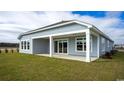 Charming backyard featuring a covered patio perfect for outdoor enjoyment at 725 Doonbeg Ct., Conway, SC 29526