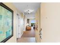 View from the unit entry to a living area with balcony and seating at 8121 Amalfi Pl. # 4-1006, Myrtle Beach, SC 29572