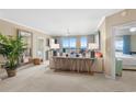 Bright living room with ocean views, a ceiling fan and neutral decor at 8500 Margate Circle # 505, Myrtle Beach, SC 29572