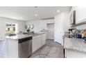 Bright kitchen boasts granite countertops, stainless steel appliances, and an open layout at 109 Dagger Ct., Myrtle Beach, SC 29588