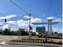 The Meadows Edge community entrance with landscaped roundabout and attractive signage at 1096 Oak Meadow Dr., Conway, SC 29526