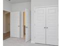 Neutral carpeted bedroom with a closet and open doorways leading to other areas at 1103 Laconic Dr., Myrtle Beach, SC 29588