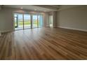 Spacious living room with a wall of sliding glass doors leading to an outdoor living area at 1117 Oxeye St., North Myrtle Beach, SC 29582