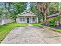 Charming single-story home featuring a well-manicured lawn, symmetrical design, and welcoming front porch at 1636 Stuart Square Circle, Myrtle Beach, SC 29577