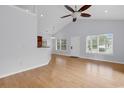 Bright living room with hardwood floors, high ceiling with fan, windows for natural light at 1636 Stuart Square Circle, Myrtle Beach, SC 29577