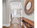 Elegant foyer with wood floors, stylish console table, and decorative mirror, welcoming guests at 1662 Westminster Dr., Myrtle Beach, SC 29577