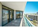 Condo balcony with railing, ocean views, and sliding glass doors at 201 74Th Ave. N # 707, Myrtle Beach, SC 29572