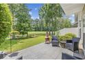 Outdoor patio featuring seating area overlooking the serene landscaping and golf course at 2150 Longwood Lakes Dr. # 2150, Myrtle Beach, SC 29579