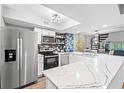 Well-lit kitchen boasting stainless steel appliances, stylish backsplash, and an adjacent dining area at 223 Maison Dr. # C-13, Myrtle Beach, SC 29572