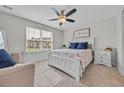 Cozy bedroom with a ceiling fan, and a large window offering plenty of natural light at 2352 Elowen Ln. # 22B, Longs, SC 29568