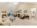 Comfortable living room boasts vaulted ceilings, fireplace, neutral tones, and an open layout at 24 Gate 7, Carolina Shores, NC 28467