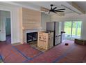 Spacious living room featuring a modern fireplace, wood floors, and large windows at 3619 Allentown Dr., Conway, SC 29526