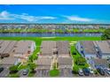 Rear exterior of residential building with spacious parking, back patios, golf course, and waterway views at 4018 Fairway Lakes Dr. # 4018, Myrtle Beach, SC 29577