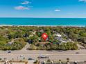 Stunning aerial view of property nestled in lush greenery with ocean in the background at 415 42Nd Ave. N, Myrtle Beach, SC 29577