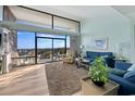 Comfortable living room with ocean view, stylish decor, and access to balcony at 423 Parker Dr. # 613, Pawleys Island, SC 29585