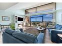 Bright living room featuring ocean views, a fireplace, and comfortable seating at 423 Parker Dr. # 613, Pawleys Island, SC 29585