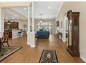 Spacious open-concept living room featuring wood floors and seamless connection to the kitchen at 499 Trestle Way, Conway, SC 29526