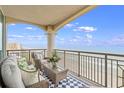 Relaxing condo balcony with seating and amazing ocean views on a bright and sunny day at 603 S Ocean Blvd. # 1504, North Myrtle Beach, SC 29582