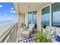 Comfortable condo balcony seating with a lovely ocean view at 603 S Ocean Blvd. # 1504, North Myrtle Beach, SC 29582