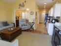 Bright open-concept living space with a comfortable sofa, recliner, and seamless transition to the kitchen at 620 Wave Rider Ln. # B10-1, North Myrtle Beach, SC 29582