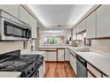 Bright kitchen with stainless appliances, and open view to the living area at 741 Retreat Beach Circle # B-1-A, Pawleys Island, SC 29585