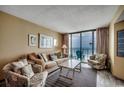 Cozy living room with comfortable seating and breathtaking balcony ocean views at 9400 Shore Dr. # 617, Myrtle Beach, SC 29572