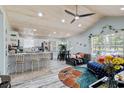 Open concept living space with a kitchen, white cabinets, and lots of natural light at 10071 Kings Rd., Myrtle Beach, SC 29572