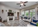 Relax in this living space with a fireplace, large windows and a ceiling fan for added comfort at 101 Karlie Ln., Aynor, SC 29511