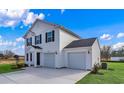 Charming two-story home with black shutters and a two-car garage at 1025 Kinness Dr., Conway, SC 29527