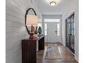 Stylish foyer featuring wood floors, a decorative table, and elegant lighting at 1106 Laconic Dr., Myrtle Beach, SC 29588