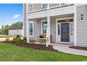 Welcoming front porch with a cozy bench and a view of the well-manicured lawn at 1106 Laconic Dr., Myrtle Beach, SC 29588