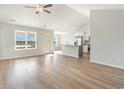 Spacious living room area with vaulted ceilings, lots of light and wood-look floors at 1107 Woodside Dr., Conway, SC 29526