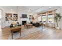 Spacious living room with built-in bookshelves, a fireplace, and ample natural light at 1114 Laconic Dr., Myrtle Beach, SC 29588